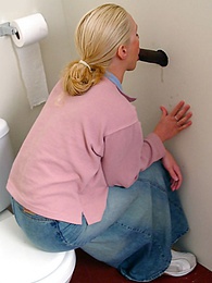 AdiPics presents: Blonde girl Jamie sits on the toilet and blows a black gloryhole dong